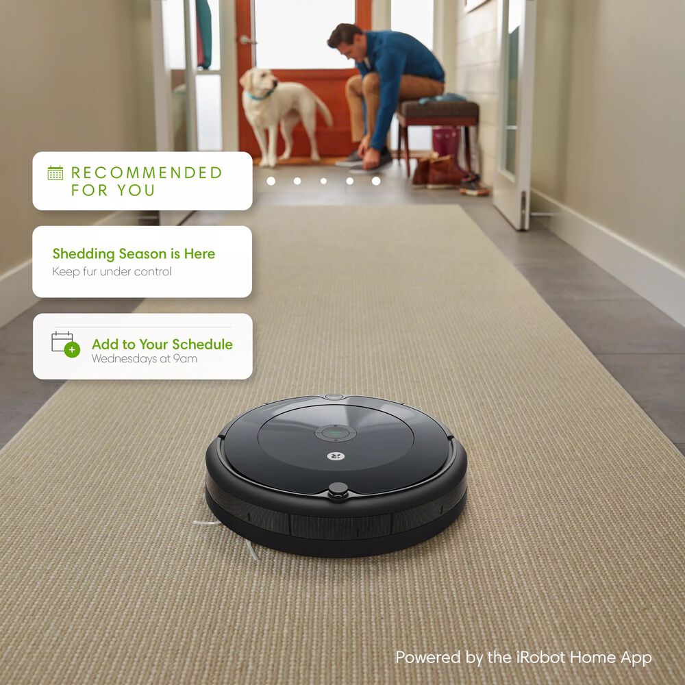 Roomba 692 vacuuming a long entryway.