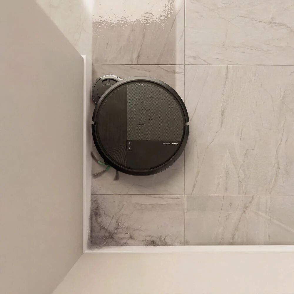 Roomba&reg; Plus 575 Combo extending brushes and mop pads to clean corners.