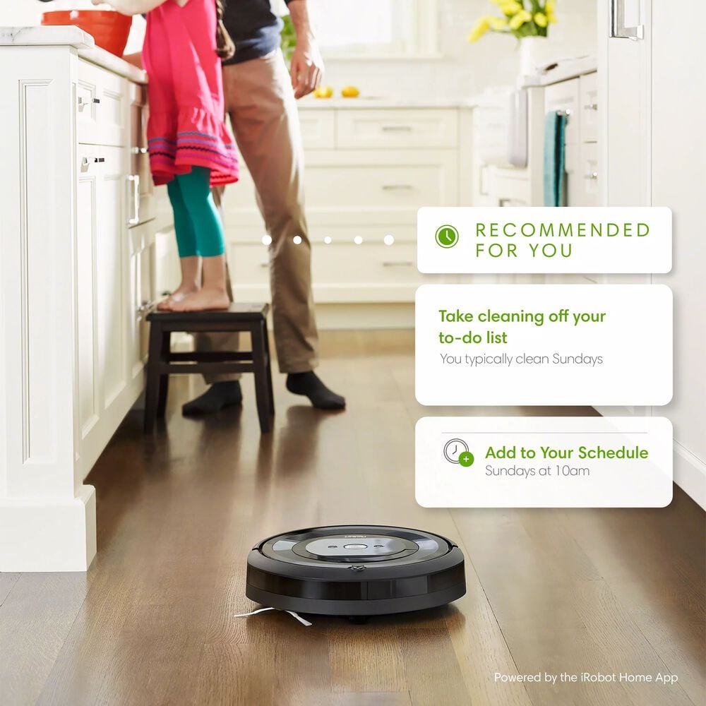 e613 vacuuming in kitchen